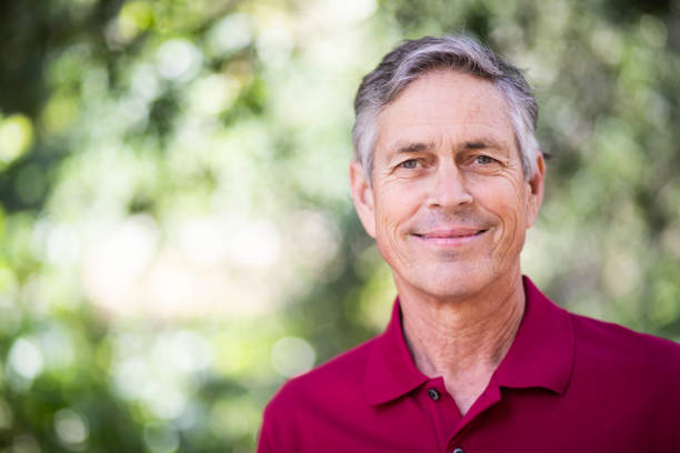 portrait of a beautiful senior man in nature
